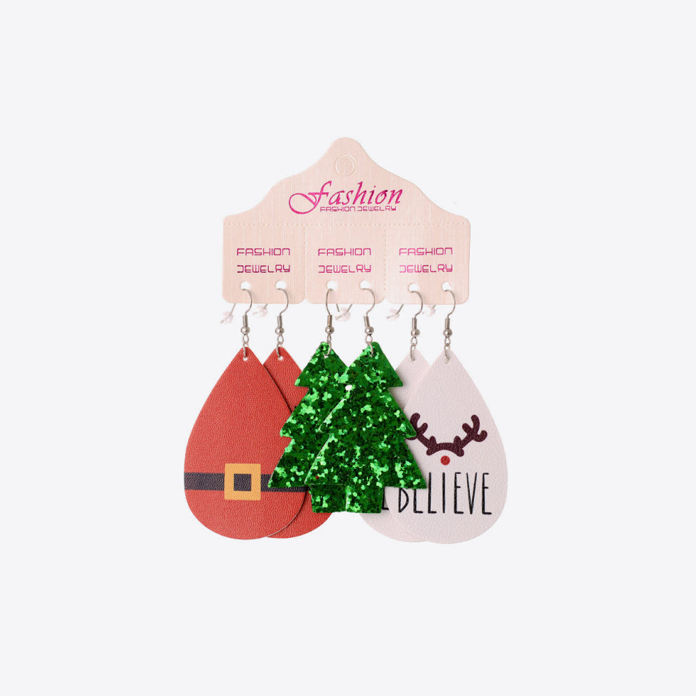 Festive drop earrings trio set with Santa, Christmas tree, and reindeer designs.