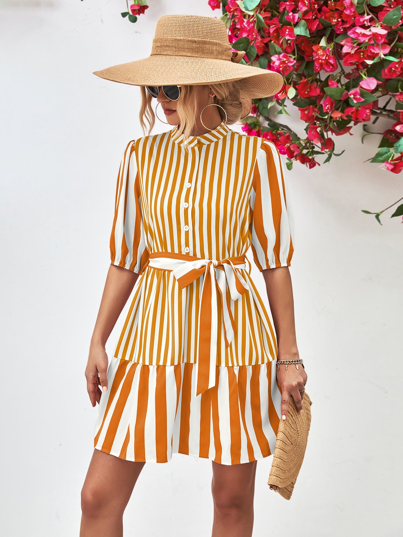 Vertical stripe shirred waist dress in gold with tie belt and tiered skirt.