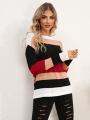 Colorblock crewneck sweater with relaxed fit and acrylic knit in black, red, tan, and white stripes.