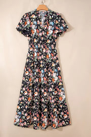 Floral tiered maxi dress with smocked waist and short puff sleeves.