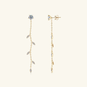 Gold dangling crystal vine earrings with delicate chain and leaf-shaped accents.