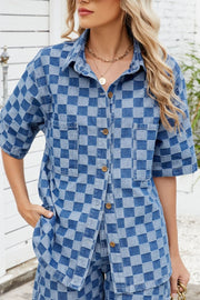 Boxy denim shirt in medium blue checkered pattern with button front and chest pockets.
