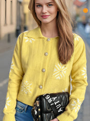 Yellow acrylic cardigan with pearl buttons and snowflake pattern