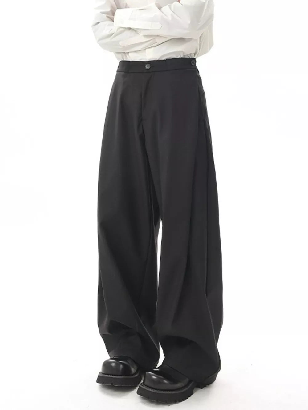 Black flowy wide-leg sweatpants for men with a relaxed fit and button closure.