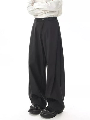 Black flowy wide-leg sweatpants for men with a relaxed fit and button closure.