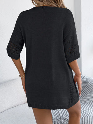 Black open-knit short sleeve duster cardigan with eyelet details on sleeves and sides.