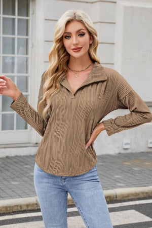 Taupe wave-effect collared long sleeve blouse with a V-neck and textured fabric.