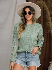 Light green openwork sleeve knit sweater with cable knit detail.