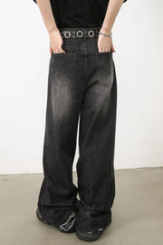 Dark balloon-leg denim jeans with subtle fade and distressed hem