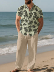 Men's relaxed fit pants in beige with drawstring, paired with a short-sleeve palm print shirt.