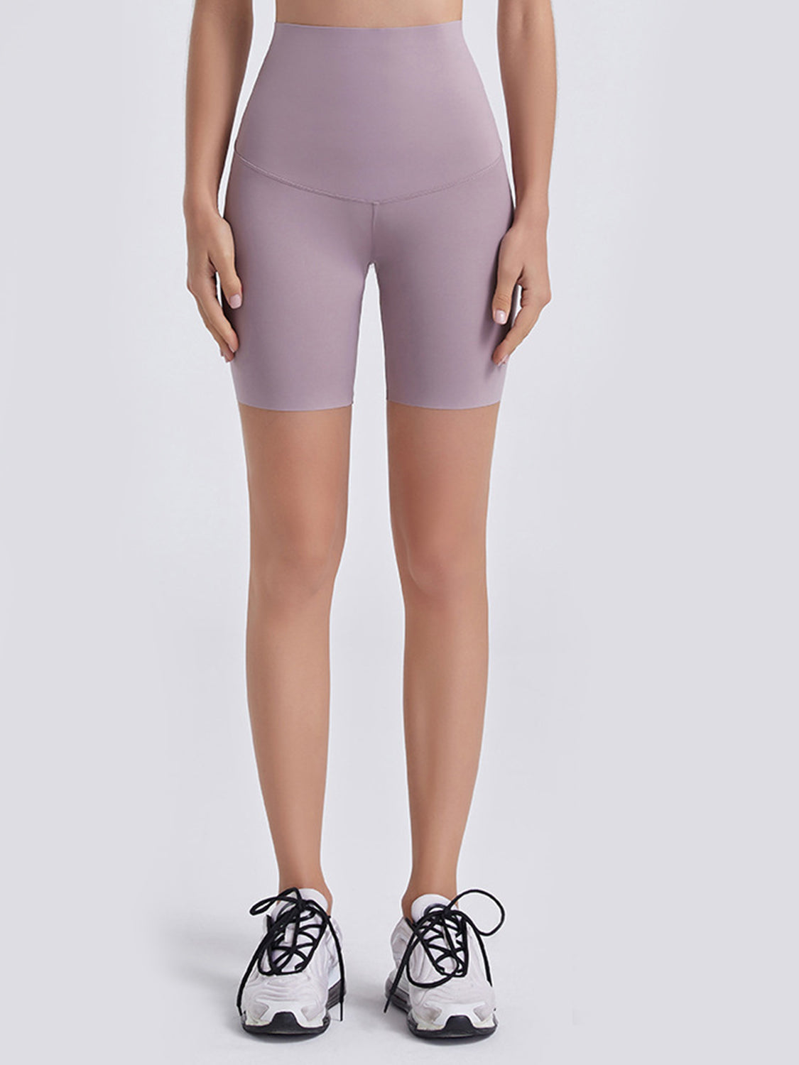 Lilac high-waist bike shorts with a V-shaped seam detail.