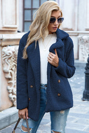 Dark Blue teddy pea coat with double-breasted closure and button details.