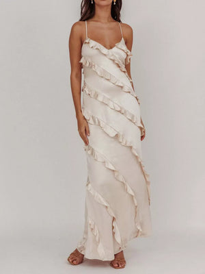 Beige ruffled spaghetti strap maxi dress with diagonal ruffle details.