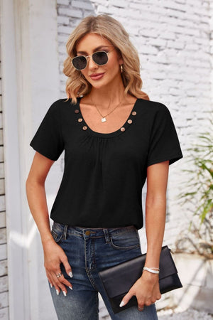 Black short sleeve top with gathered yoke and button trim, crew neck