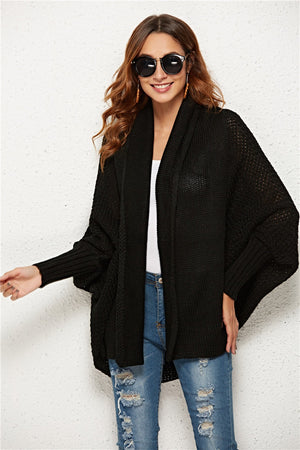 Black textured cocoon knit cardigan with batwing sleeves and open front.