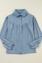 Indigo Dreams button-up blouse in medium blue denim with ruffled collar and cuffs.