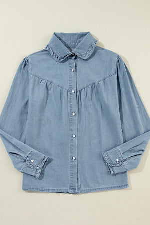 Indigo Dreams button-up blouse in medium blue denim with ruffled collar and cuffs.
