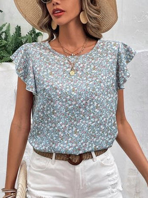 Light blue floral flutter sleeve blouse with a round neckline.
