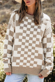 Geometric knit checkerboard pullover sweater in mocha and cream with crew neck and ribbed trim.