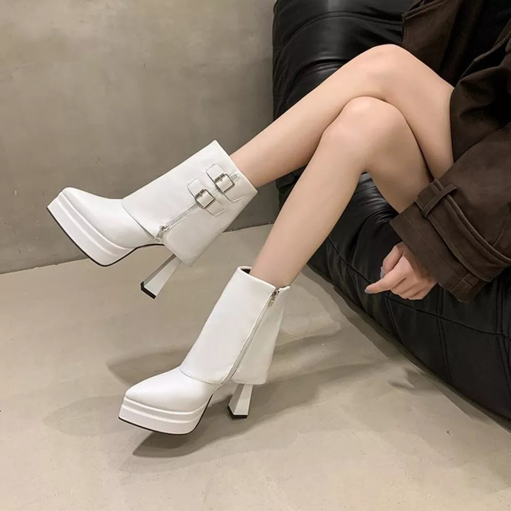 White ankle boots with pointed toe, block heel, platform, buckle straps and side zipper.