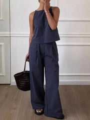 Blue striped sleeveless top and wide-leg pants set with a high neckline.