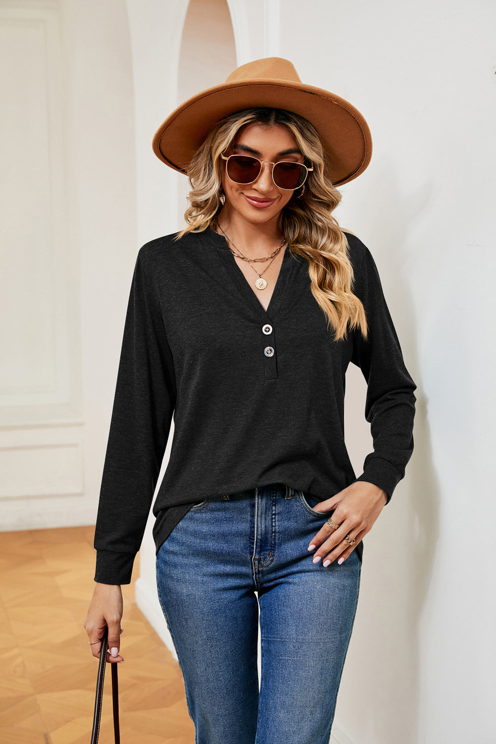 Black long sleeve Henley top with button detail and v-neck
