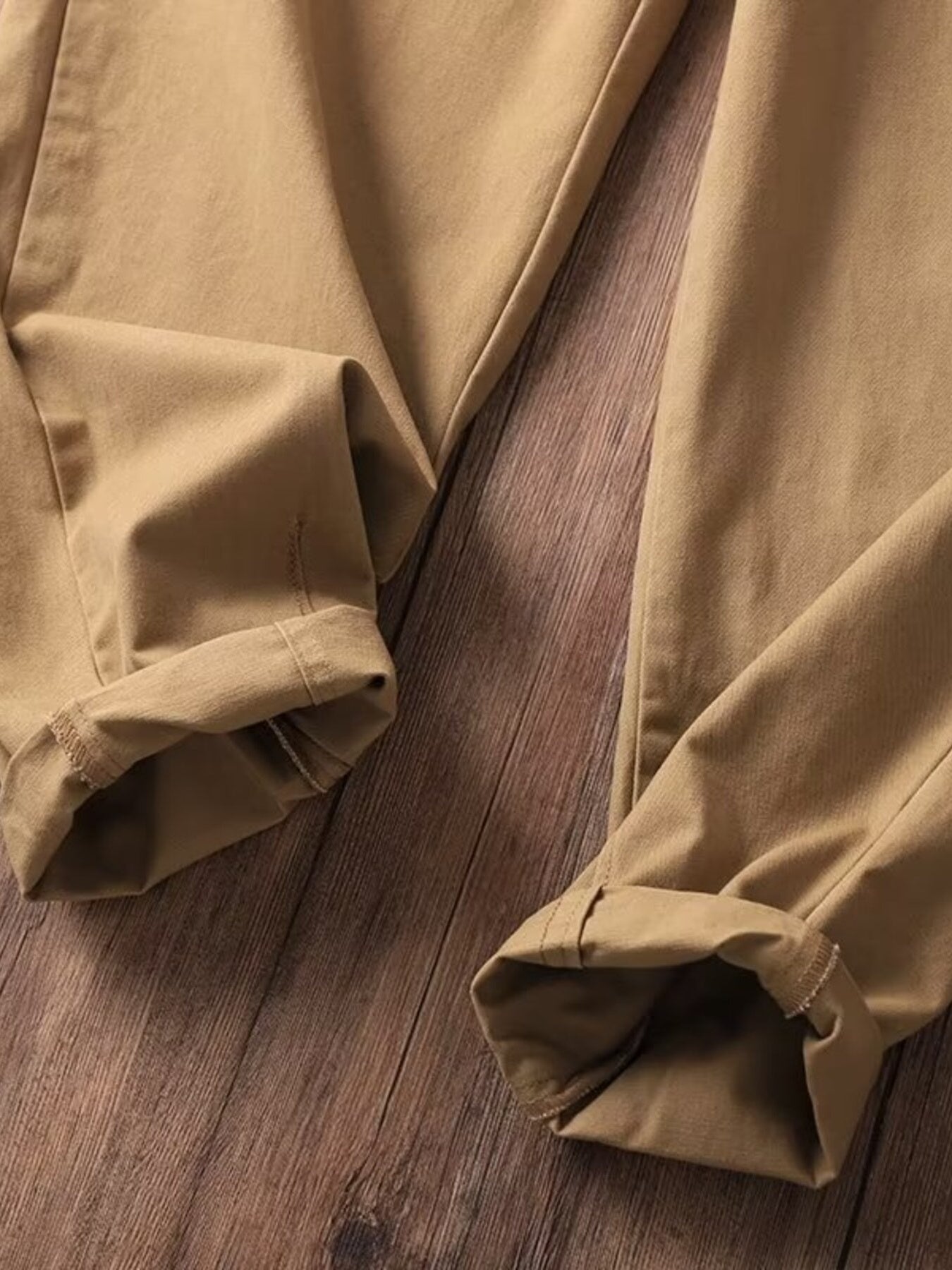 Men's tan loose fit sweatpants with cuffed hems.