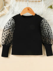 Black toddler top with polka dot sheer puff sleeves and ribbed body.