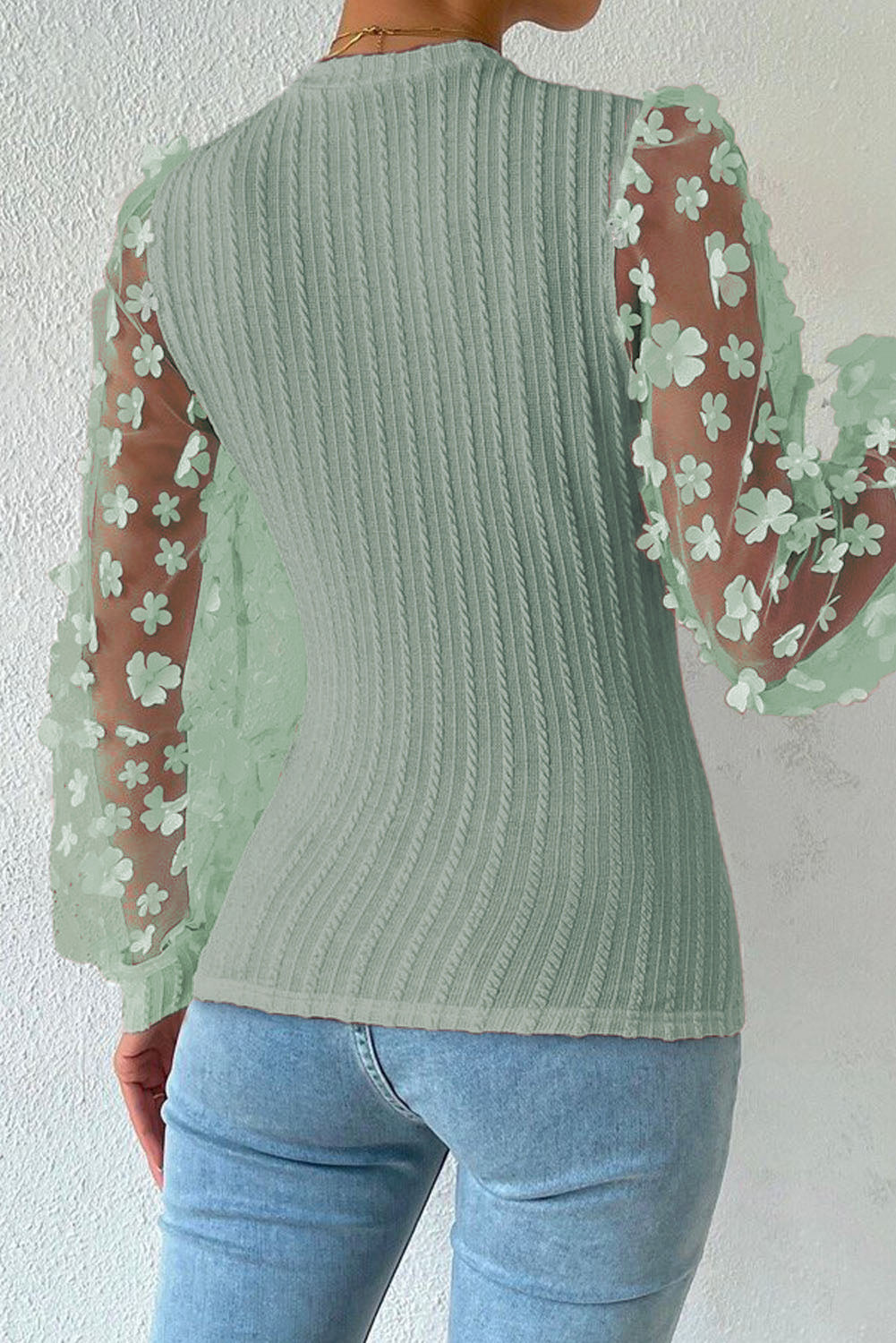 Sage knit top with sheer floral appliqué sleeves