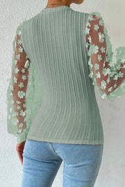 Sage knit top with sheer floral appliqué sleeves