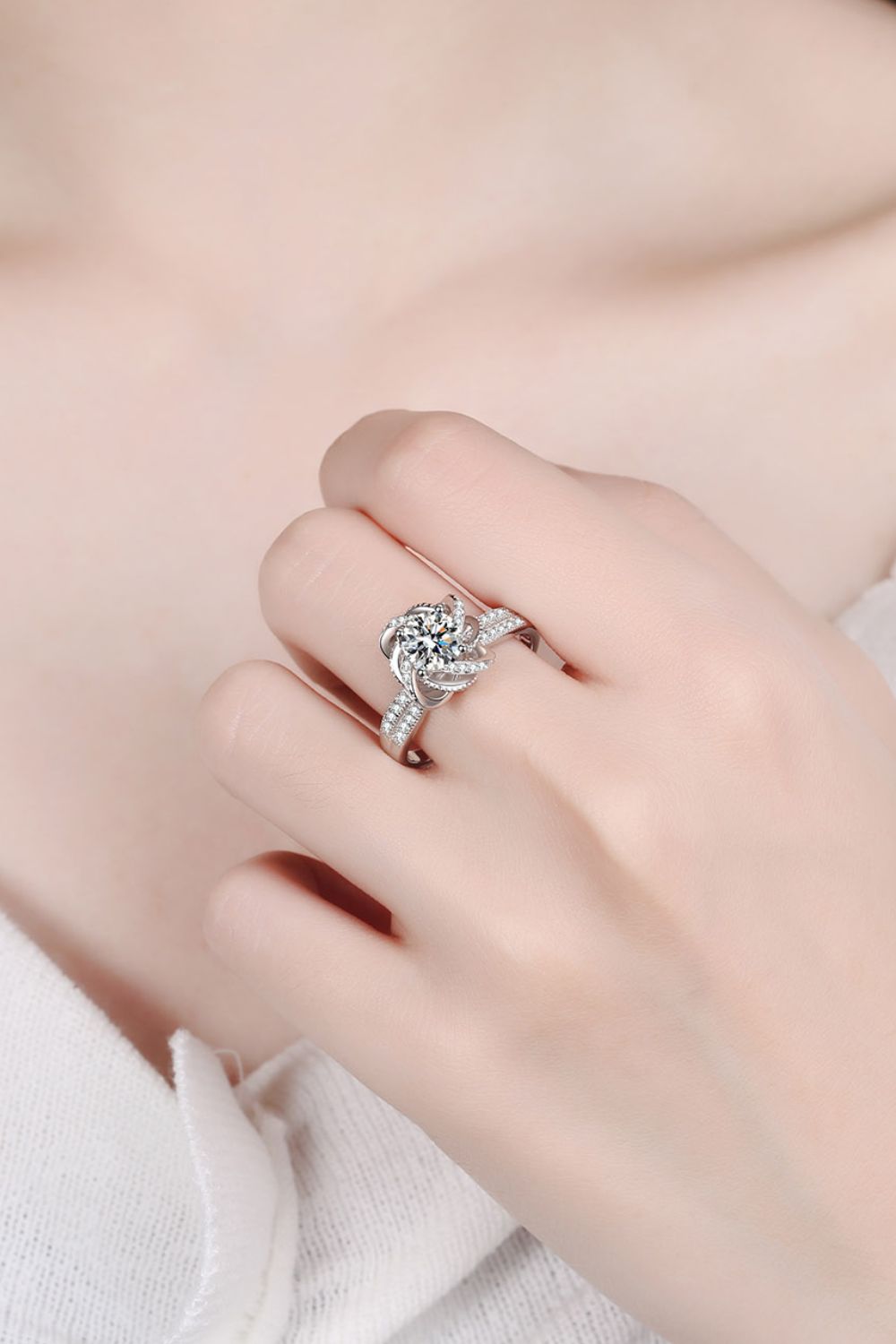 Silver ring with floral halo moissanite and pave band