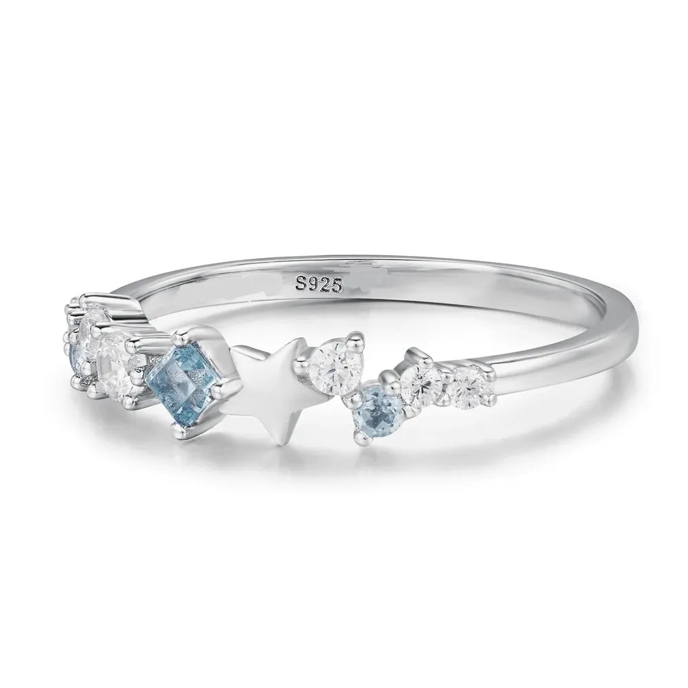 Silver ring with star and celestial cluster zircon details