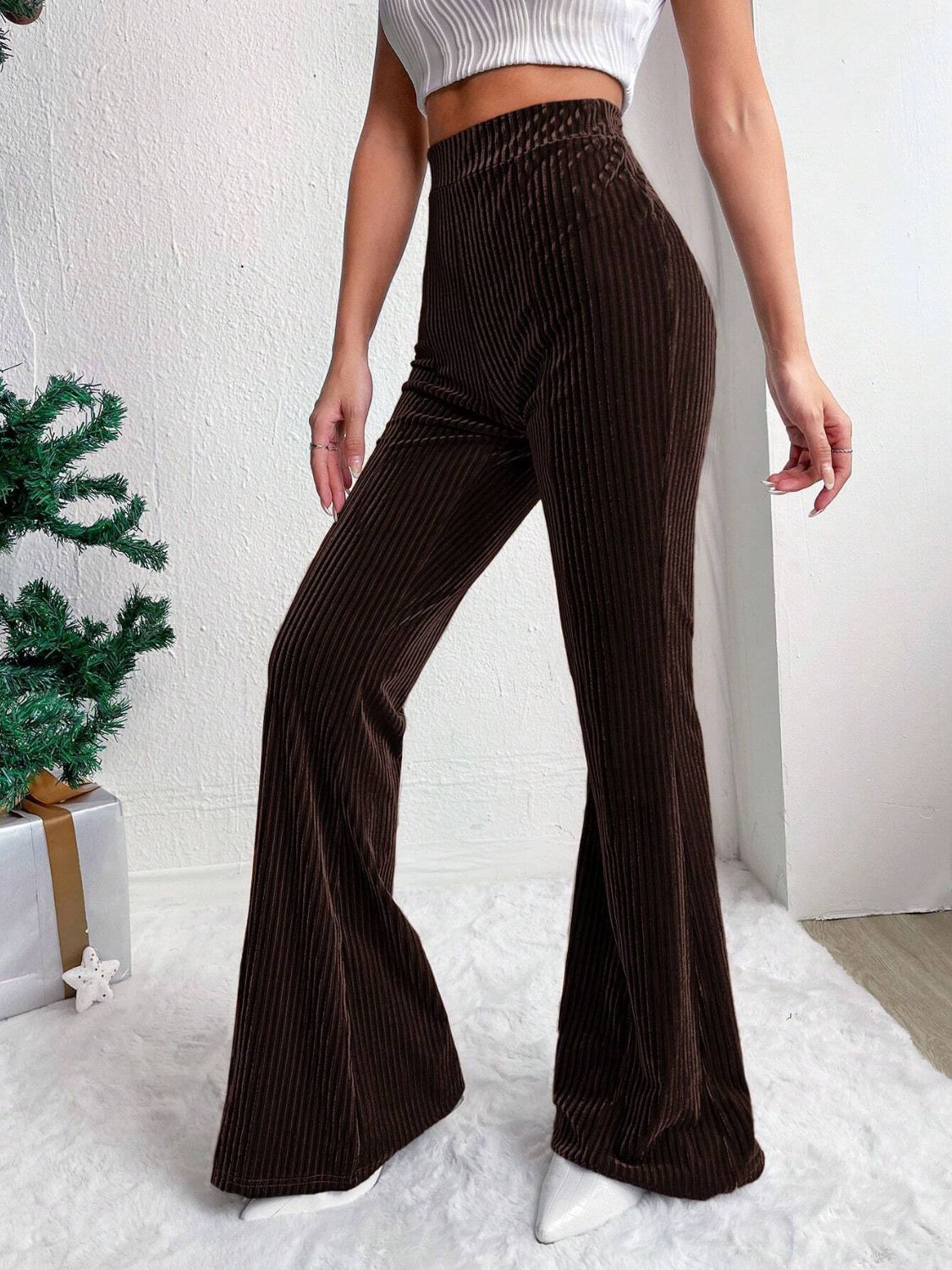 Textured corduroy bell bottom trousers in chocolate brown with a high waist.