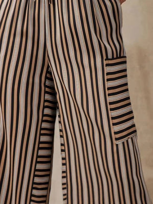 Coastal Stripe Cargo Culottes in black with tan and white stripes, featuring a cargo pocket detail.