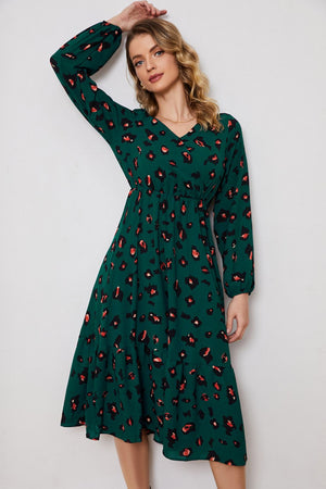 Emerald leopard print midi dress with V-neck and long sleeves.