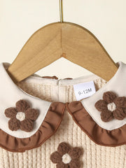 Baby girls' tan two-piece set with floral applique and ruffled collar detail.