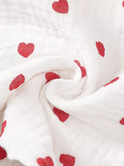 White cotton baby outfit with red heart print and headband detail