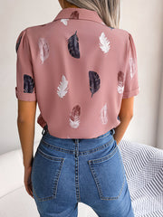 Dusty pink feather print collared puff sleeve blouse with rolled cuffs.