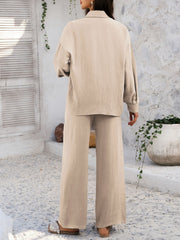 Tan textured resort shirt and wide leg pants set with buttoned front and collared neckline.