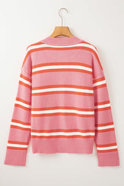 Pink knit cardigan with retro stripes in white and coral, long sleeves, crew neck.