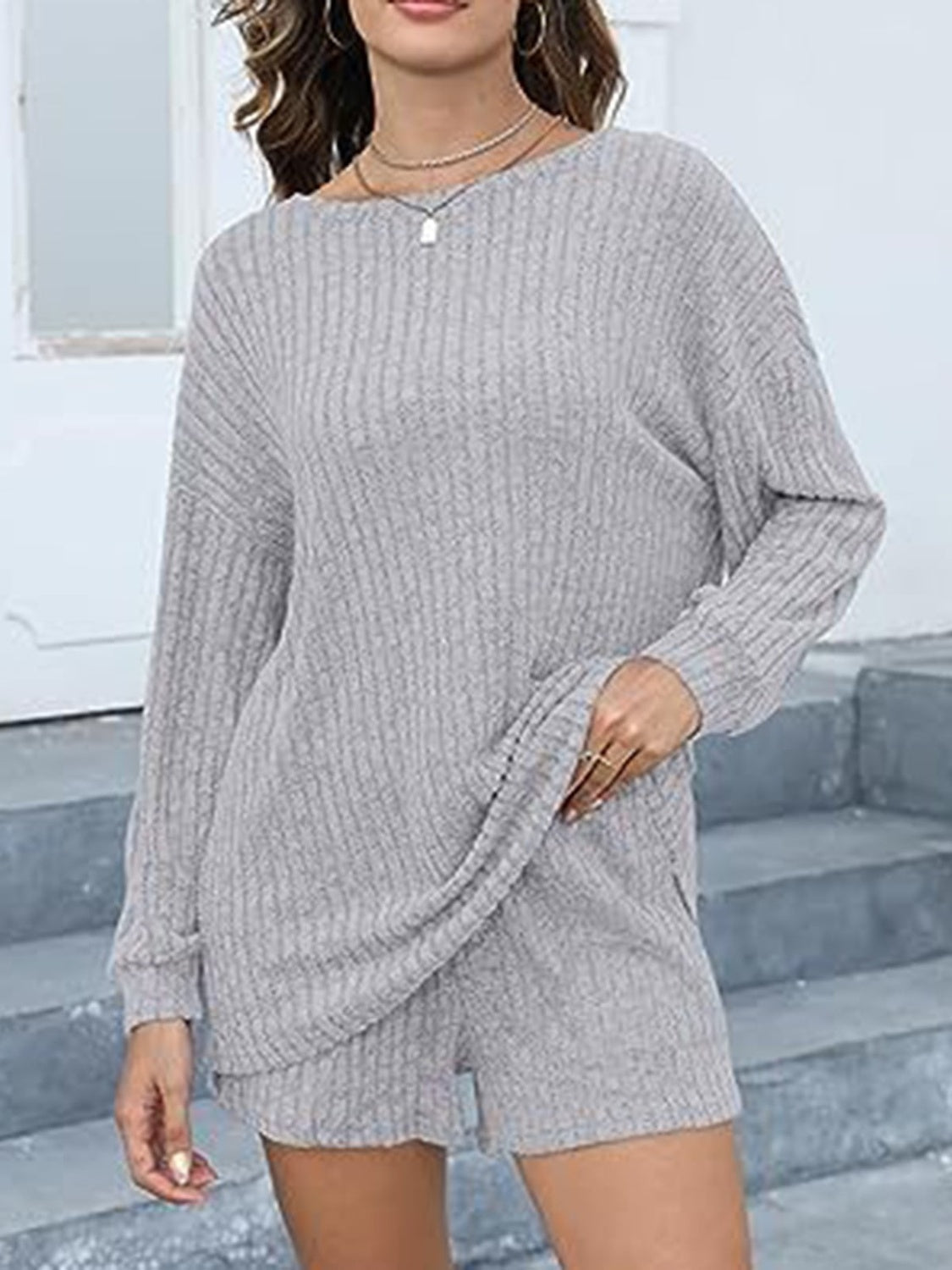 Light gray ribbed knit loungewear set with long sleeves and shorts, featuring pockets.