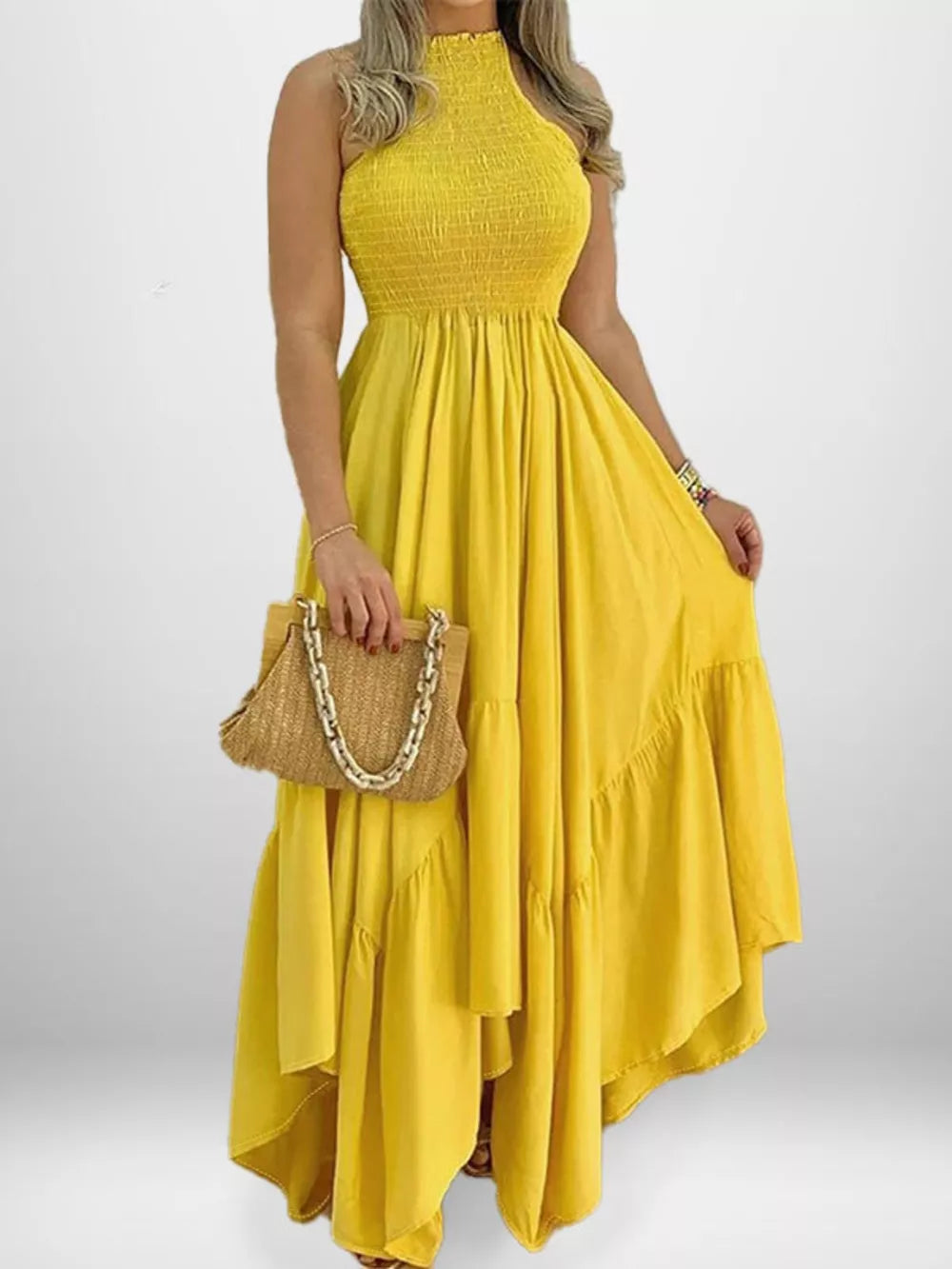 Yellow smocked halter maxi dress with ruffle hem and flowy skirt.