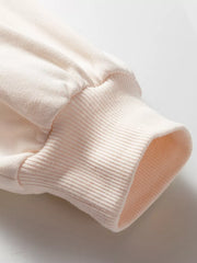 Oversized cotton sweatshirt cuff detail in light pink with ribbed texture