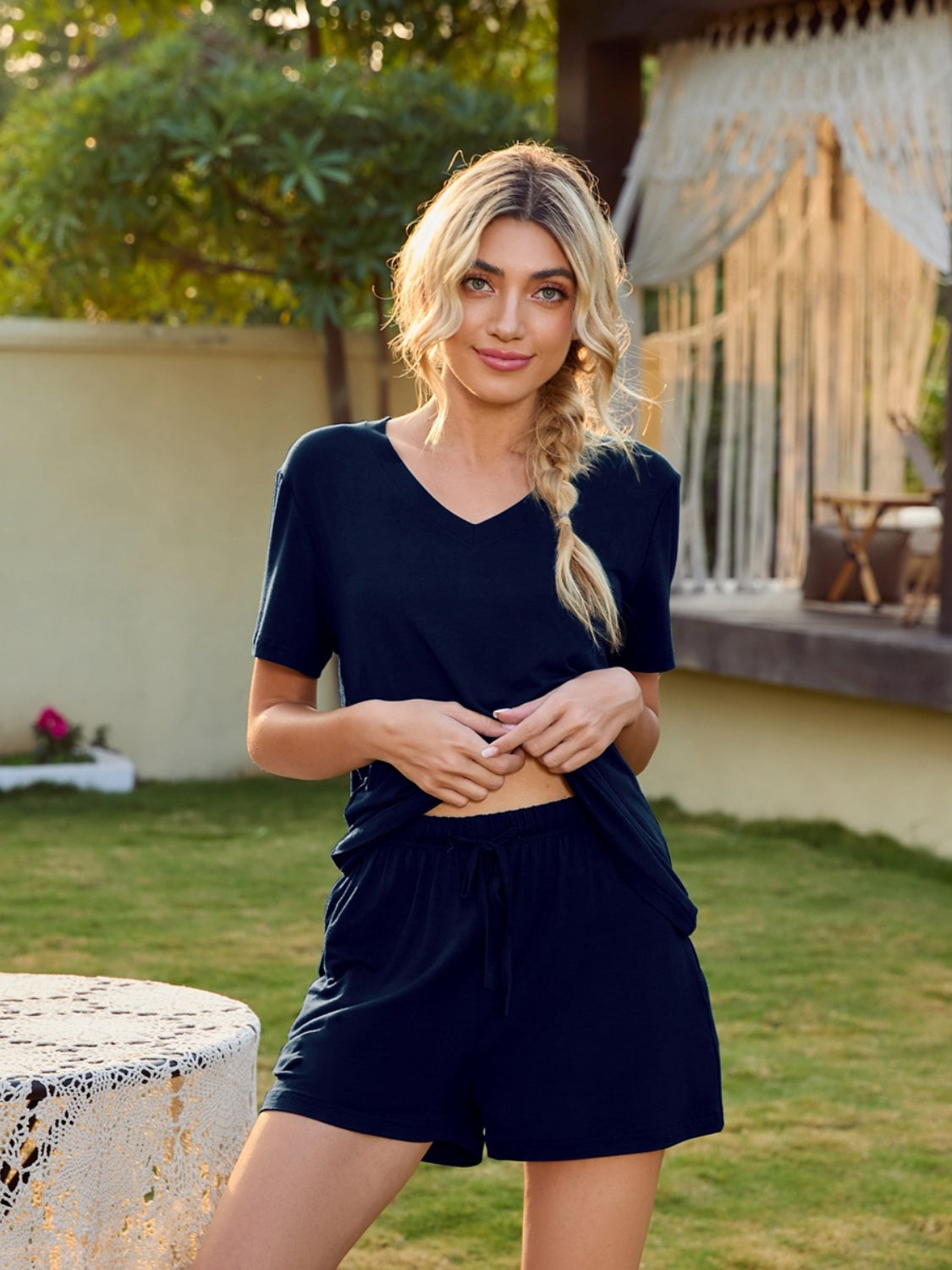 Dark blue V-neck lounge set with shorts and a relaxed fit t-shirt.