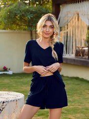 Dark blue V-neck lounge set with shorts and a relaxed fit t-shirt.