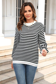 Classic Breton stripe knit crewneck sweater in black and white acrylic.