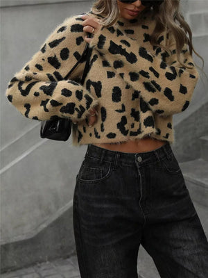 Cropped fuzzy knit sweater with playful leopard print and long sleeves.