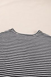 Textured knit t-shirt with a notched neckline and black and white horizontal stripes.