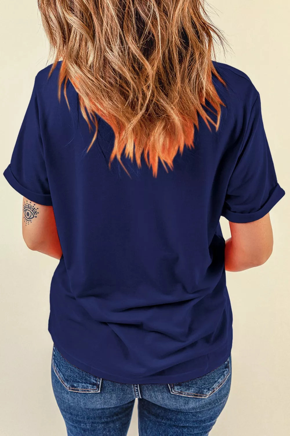 Navy cotton maternity t-shirt with cuffed short sleeves and round neck.