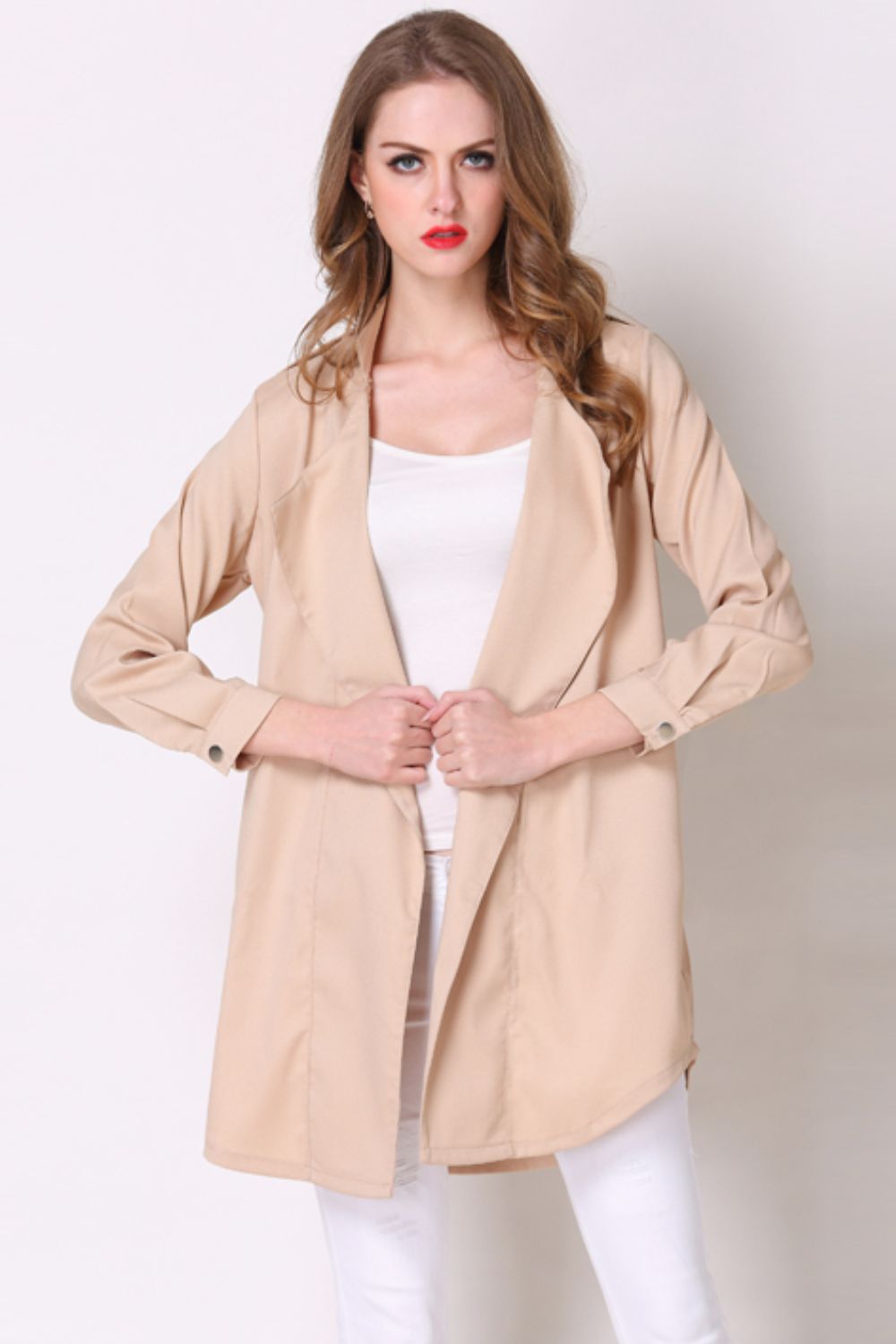 Tan drape-front trench coat with buttoned cuffs and shoulder detailing